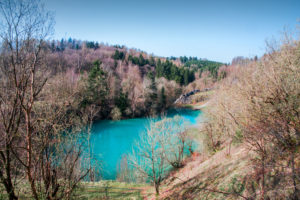 Beautiful blue mountain lake. The Blue Colour is caused by former limestone mining. (Blauer See, Rübeland, Hüttenrode near Blankenburg, National Park Harz in Germany Beautiful blue mountain lake. The Blue Colour is caused by former limestone mining. (Blauer See, Rübeland, Hüttenrode near Blankenburg, National Park Harz in Germany